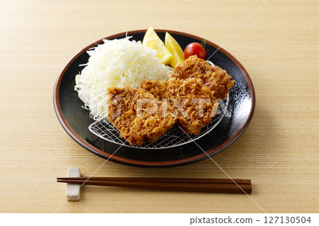 Delicious pork fillet cutlet served on a plate 127130504