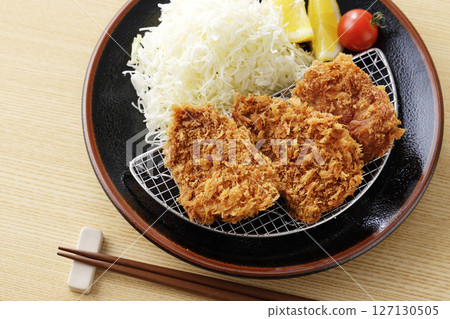 Delicious pork fillet cutlet served on a plate 127130505