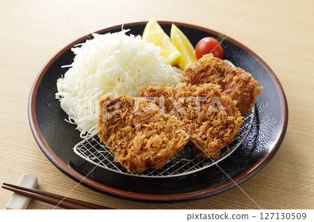 Delicious pork fillet cutlet served on a plate 127130509