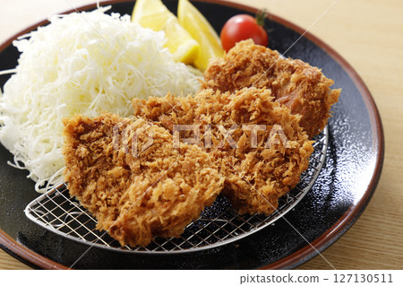 Delicious pork fillet cutlet served on a plate 127130511