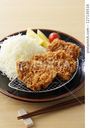 Delicious pork fillet cutlet served on a plate 127130516