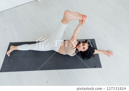Fitness Woman Brunette Doing Gymnastics Yoga 127131824