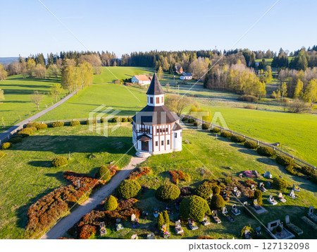 Set against a lush green landscape, Tesarov Chapel features a distinctive octagonal design. Its striking white exterior stands out in the serene surroundings of Korenov, Czechia, during a clear day. Set against a lush green landscape, Tesarov Chapel features a distinctive octagonal design. Its striking white exterior stands out in the serene surroundings of Korenov, Czechia, during a clear day. 127132098