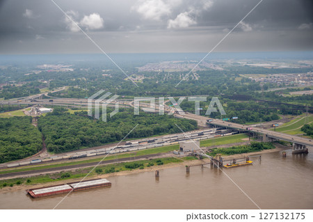 High view of barge, train, and road transportation and commerce High view of barge, train, and road transportation and commerce 127132175