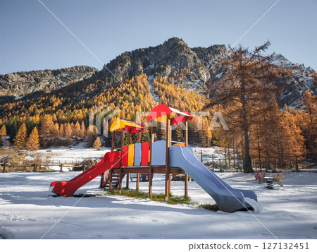 Vibrant playground nestled among snow peaked mountains and golden autumn trees in scenic aosta valley, northern italy Frazionne Lillaz Vibrant playground nestled among snow peaked mountains and golden autumn trees in scenic aosta valley, northern italy Frazionne Lillaz 127132451