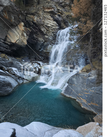Cascading waterfall plunging into turquoise pool, rocky landscape framing verdant forest scene in aosta valley, italian alpine setting Cascate di Lillaz Cascading waterfall plunging into turquoise pool, rocky landscape framing verdant forest scene in aosta valley, italian alpine setting Cascate di Lillaz 127132465