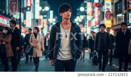 Handsome man walking through downtown at night Handsome man walking through downtown at night 127132615