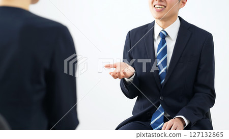 A group of male and female business people having an interview 127132865