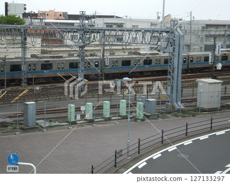 Sidewalk and train in front of Sagami-Ono Station 127133297