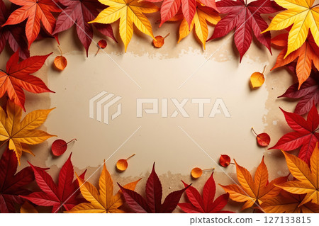 Colorful autumn leaves frame a blank beige background. 127133815