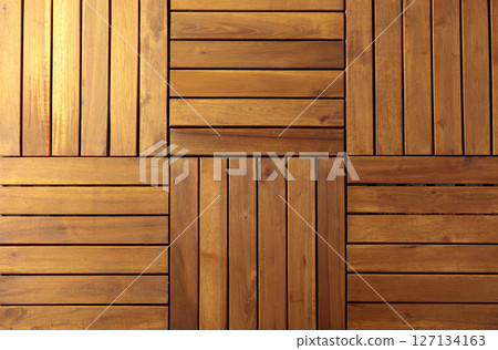 Decorative surface made of brown wooden slats. 127134163