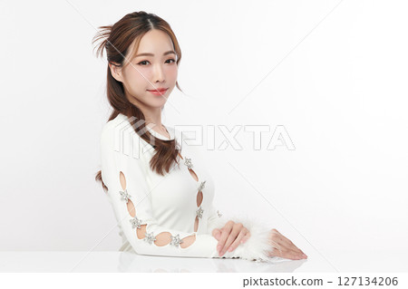 A beautiful young Asian woman with clean, fresh skin against a white background. Skincare, facial treatment, cosmetology, beauty, and spa. An elegant portrait of an Asian woman. A beautiful young Asian woman with clean, fresh skin against a white background. Skincare, facial treatment, cosmetology, beauty, and spa. An elegant portrait of an Asian woman. 127134206