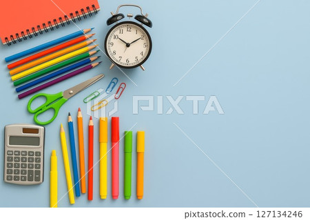 Flat Lay of Colorful School Supplies on Blue Background with Copy Space 127134246