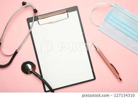 Blank clipboard with stethoscope on pink background. World Health Day Blank clipboard with stethoscope on pink background. World Health Day 127134310