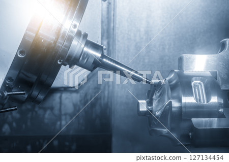 The 5-axis CNC milling machine multi-tasking type finish cutting the automotive part with solid ball nose end mill tool. The 5-axis CNC milling machine multi-tasking type finish cutting the automotive part with solid ball nose end mill tool. 127134454