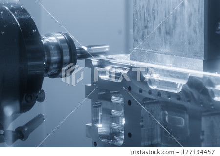 The horizontal CNC milling machine cutting the aluminum automotive parts by solid flat nose end mill tool in the light blue scene. The horizontal CNC milling machine cutting the aluminum automotive parts by solid flat nose end mill tool in the light blue scene. 127134457