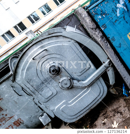 Metal trash container. 127136214