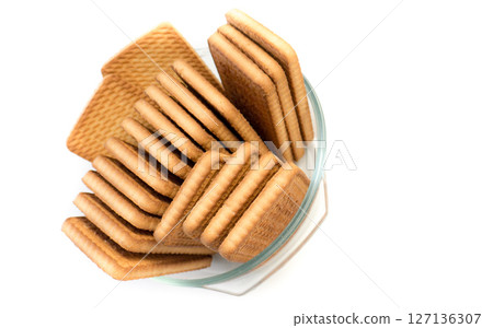 Cookies in a glass plate on a white background. Cookies in a glass plate on a white background. 127136307