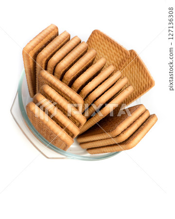 Cookies in a glass plate on a white background. Cookies in a glass plate on a white background. 127136308