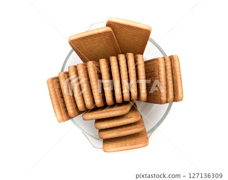 Cookies in a glass plate on a white background. 127136309