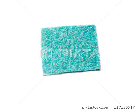 A piece of turquoise material isolated on a white background. A piece of turquoise material isolated on a white background. 127136517