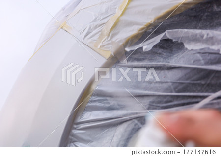 Car bumper scratch repair, body color spray painting 127137616