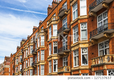 Classic London Architecture Featuring Red Brick Facades and Ornate Balconies 127137637