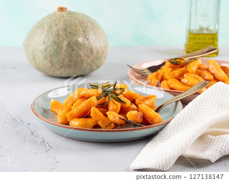 Pumpkin recipe homemade gnocchi on pastel color background Pumpkin recipe homemade gnocchi on pastel color background 127138147