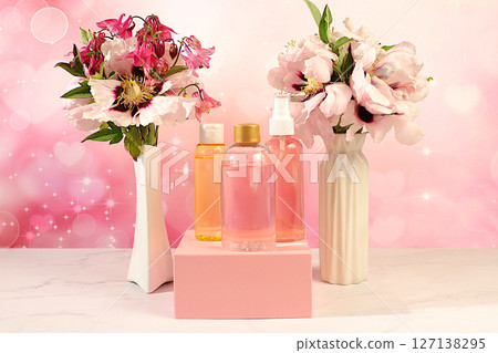 Spa salon advertising card, Wellness composition with rose water, fresh flowers of mountain peony and columbine, concept of natural self-care and healthy lifestyle, abstract composition with flowers.. Spa salon advertising card, Wellness composition with rose water, fresh flowers of mountain peony and columbine, concept of natural self-care and healthy lifestyle, abstract composition with flowers.. 127138295