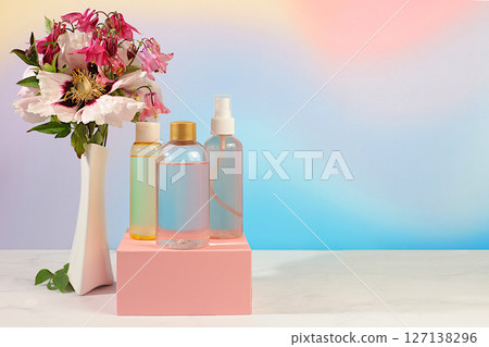 Spa salon advertising card, Wellness composition with rose water, fresh flowers of mountain peony and columbine, concept of natural self-care and healthy lifestyle, abstract composition with flowers. Spa salon advertising card, Wellness composition with rose water, fresh flowers of mountain peony and columbine, concept of natural self-care and healthy lifestyle, abstract composition with flowers. 127138296