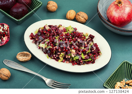 Healthy vegan beetroot salad with walnuts. 127138424