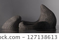 Abstract rocks for product display floating on reflective water 127138613