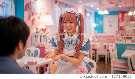 Maid cafe maid serving customers 127139032