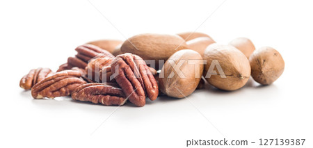 Peeled pecan nuts isolated on white background. Peeled pecan nuts isolated on white background. 127139387