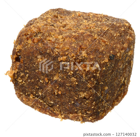 Brown dog snack or treat with a textured, crumbly surface, isolated background 127140032