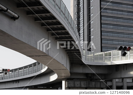 A large steel pedestrian bridge in the city A large steel pedestrian bridge in the city 127140096