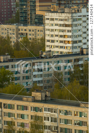 urban landscape with tall buildings and several trees, residential area, multi-storey buildings. urban landscape with tall buildings and several trees, residential area, multi-storey buildings. 127140414