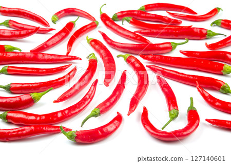 Red hot chili peppers on a white background. Vitamin vegetable food Red hot chili peppers on a white background. Vitamin vegetable food 127140601