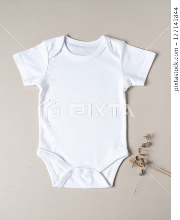 White Baby Bodysuit on Beige Background 127141844