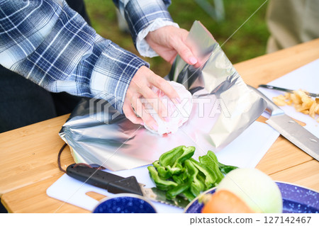 Baked apples, senior couple, camping, outdoor, barbecue, BBQ, family 127142467