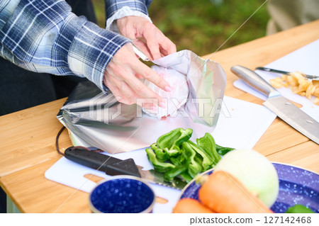 Baked apples, senior couple, camping, outdoor, barbecue, BBQ, family 127142468