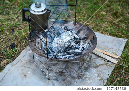Foil baked, foil wrapped, camping, outdoor, barbecue, BBQ, family, parent and child 127142586