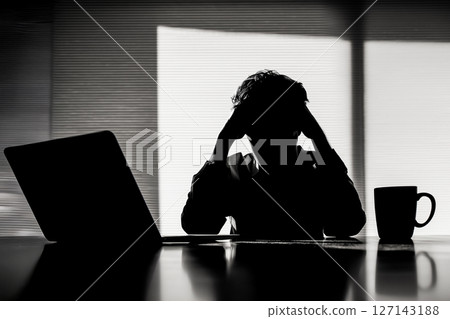 Depressed office worker with poor posture 127143188