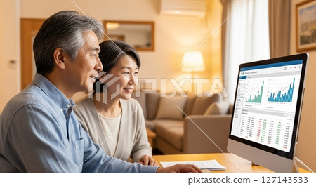 Asset formation to ensure peace of mind in retirement: A senior couple learning about savings investment with smiles Asset formation to ensure peace of mind in retirement: A senior couple learning about savings investment with smiles 127143533