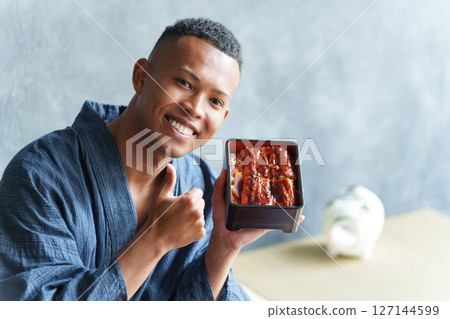 Foreign tourists eating Japanese food 127144599