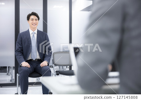 Business image of job interview or promotion interview, young man in suit, full body wide angle Business image of job interview or promotion interview, young man in suit, full body wide angle 127145808