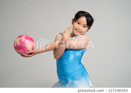 A lively girl trying gymnastics A lively girl trying gymnastics 127146565