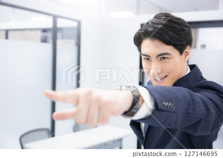 A business scene of a man in a suit pointing at goals, success, success, etc. Positive words such as success for the future and hope 127146695