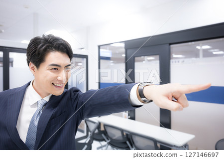 A business scene of a man in a suit pointing at goals, success, success, etc. Positive words such as success for the future and hope A business scene of a man in a suit pointing at goals, success, success, etc. Positive words such as success for the future and hope 127146697