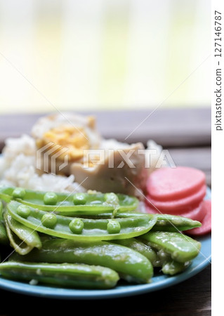 Stir-fried snap peas with lemon and koji Healthy vegetable rice Stir-fried snap peas with lemon and koji Healthy vegetable rice 127146787